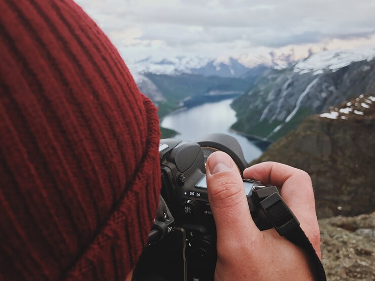 man takes picture gorgeous scandinavian landscape 1304 5328